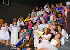 Catalyst Theatre Company in costume in an audotorium