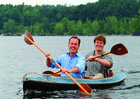 Peter Espenshade and Chris Boget paddling a kayak on Lake Champlain