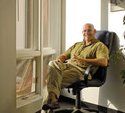 Larry Hall sitting in an office chair